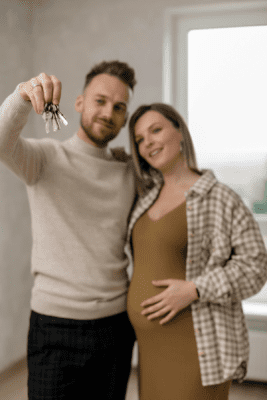 couple expecting a baby purchasing a home for growing family