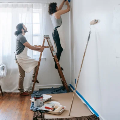 couple working on DIY home improvements in their new house