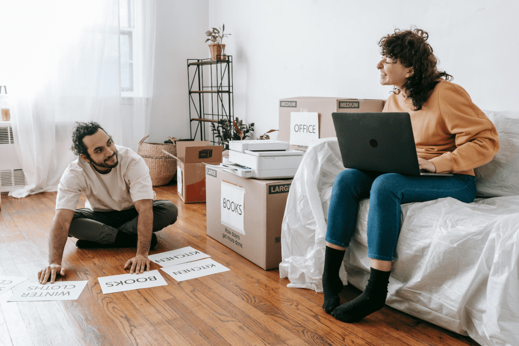 couple packing to move homes