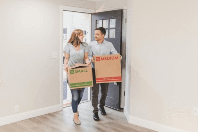 couple moving into their new home with boxes