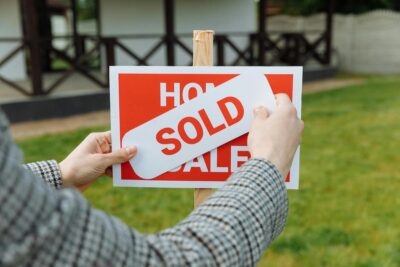 buying a home sold sign