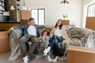 family-sitting-on-new-couch